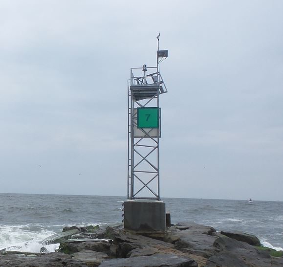 Weather observation tower and antenna on the coast of the ocean
