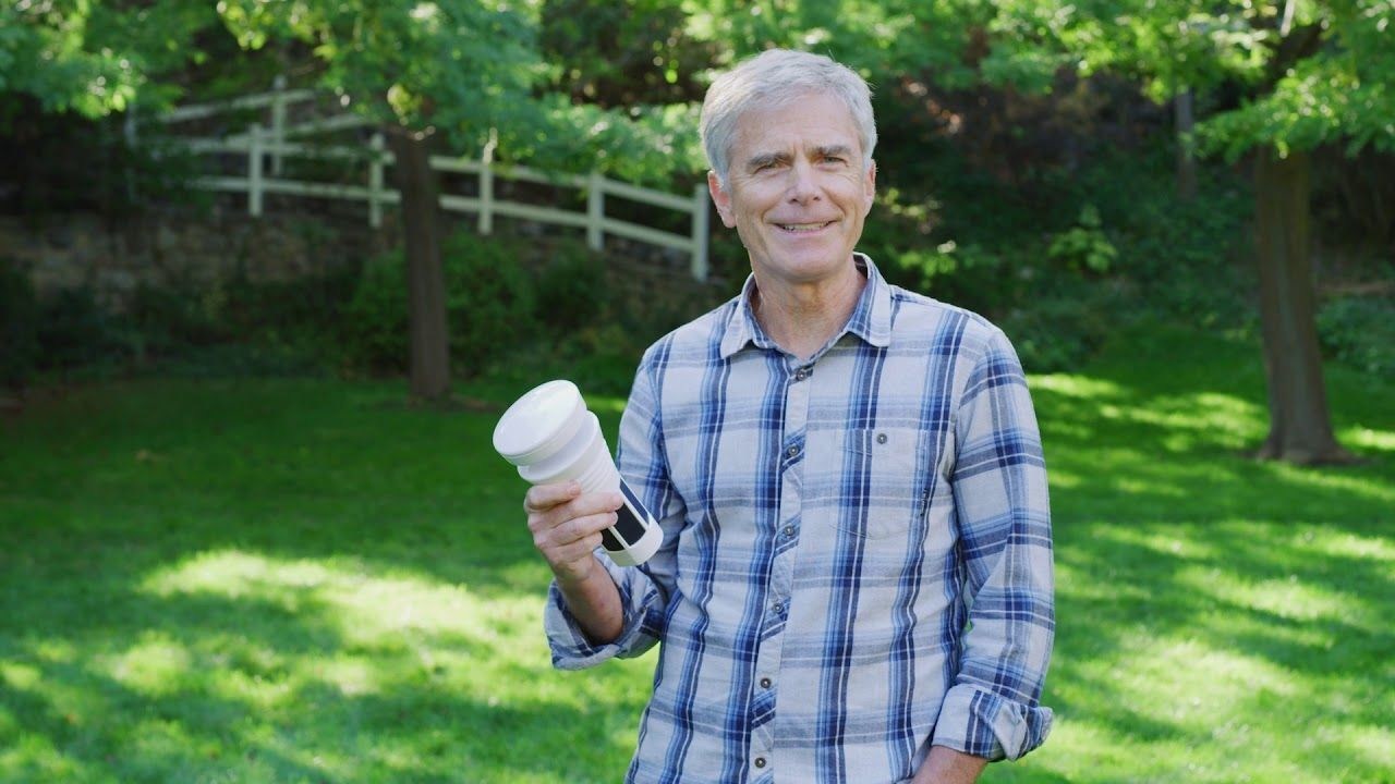 Tempest-WeatherFlow CEO & Founder Buck Lyons holding a Tempest Weather Station outside