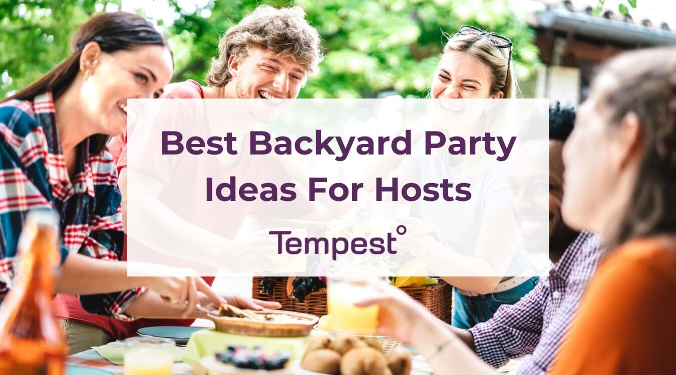 friends at a table enjoying a backyard party