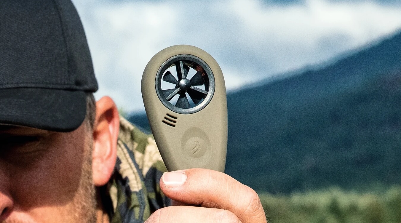 a hunter using the WEATHERmeter for precision shooting to help with hunting