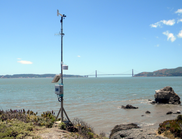 Weather station antenna set up on Point Blunt in California with a bridge in the background