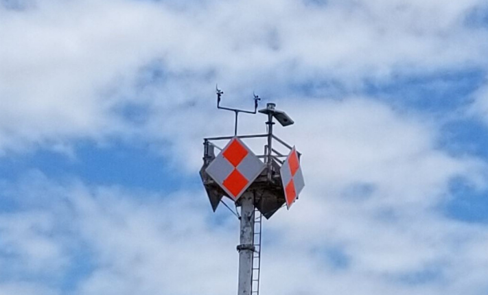 Weather antenna with a cloudy sky
