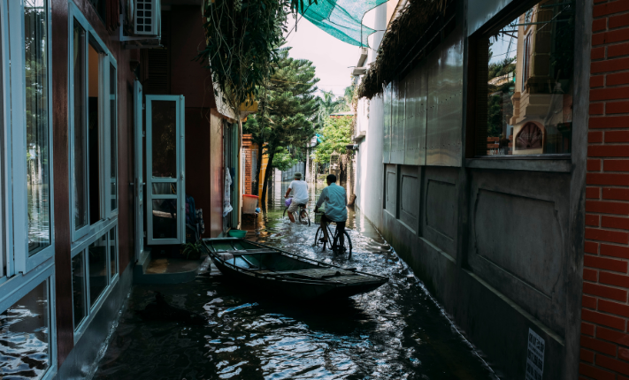A residential alleyway flooded by a recent tropical storm