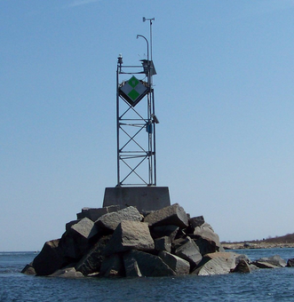 Woods Hole weather antenna installed on a rocky island